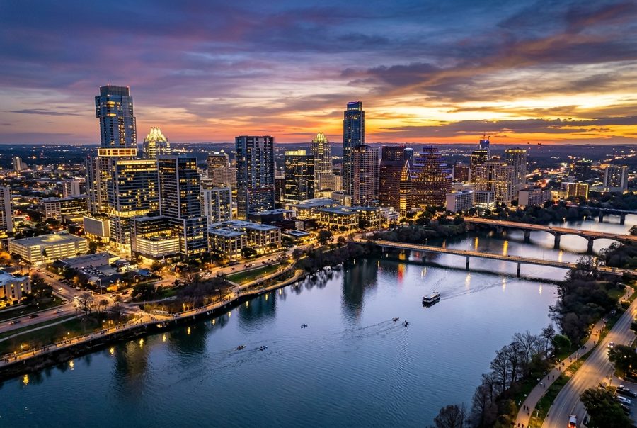 Aerial view of the Austin skyline at dusk over Lady Bird Lake